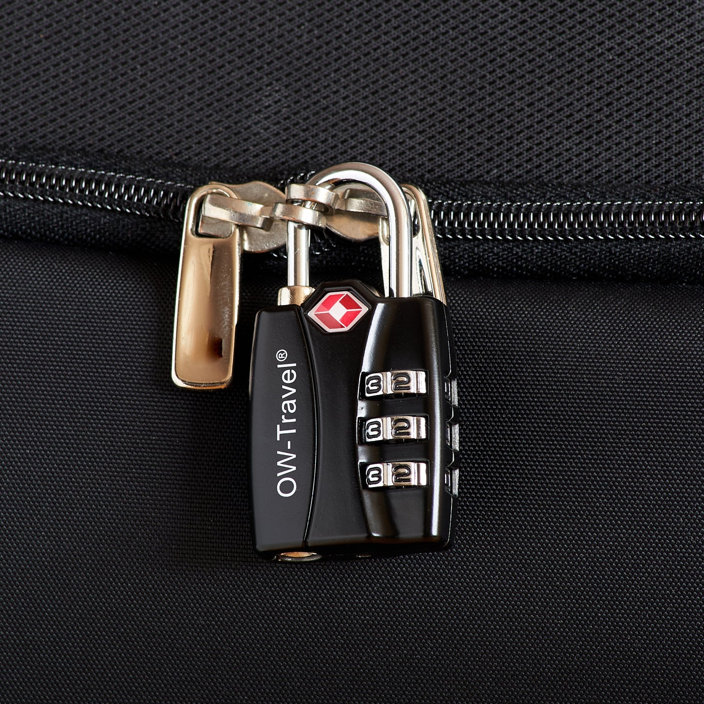 TSA luggage locks. Black 3-dial combination padlock with inspection alert